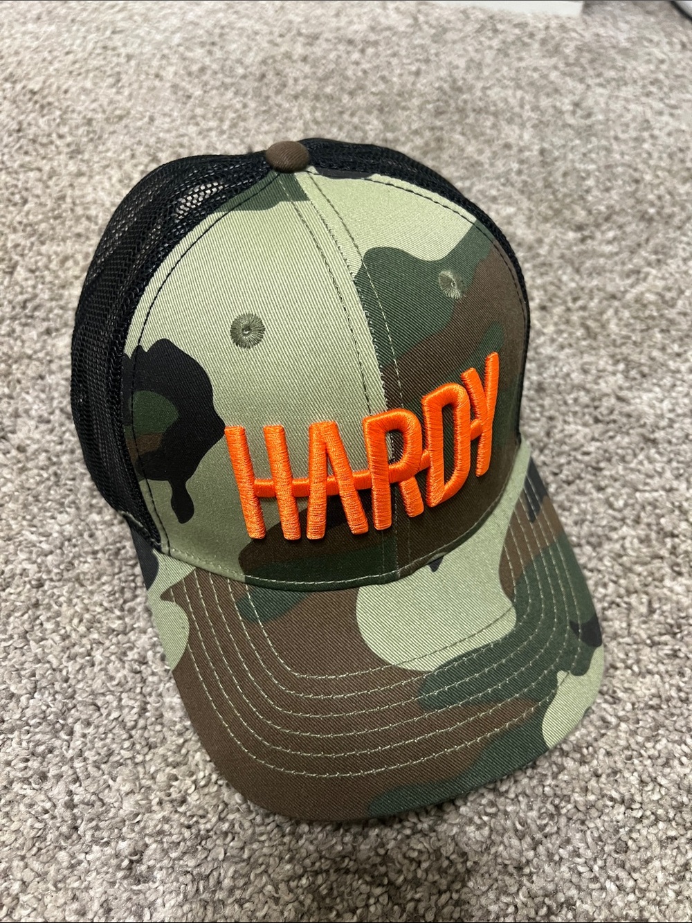 Camo Trucker Hat with Bright Orange Logo